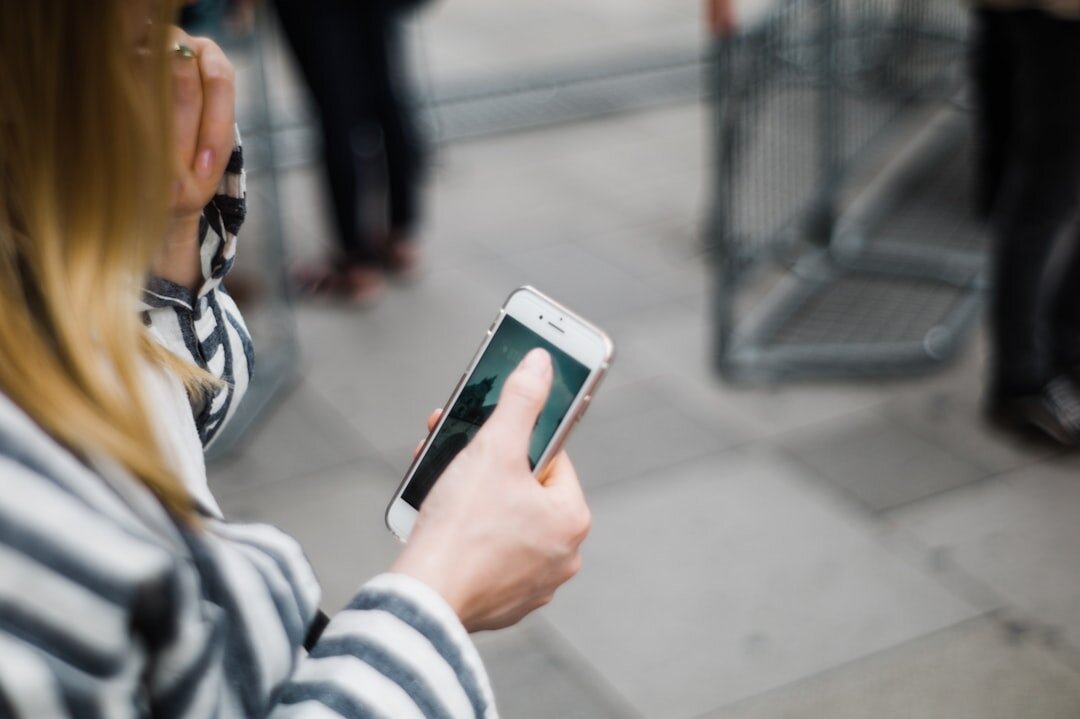 woman checking phone